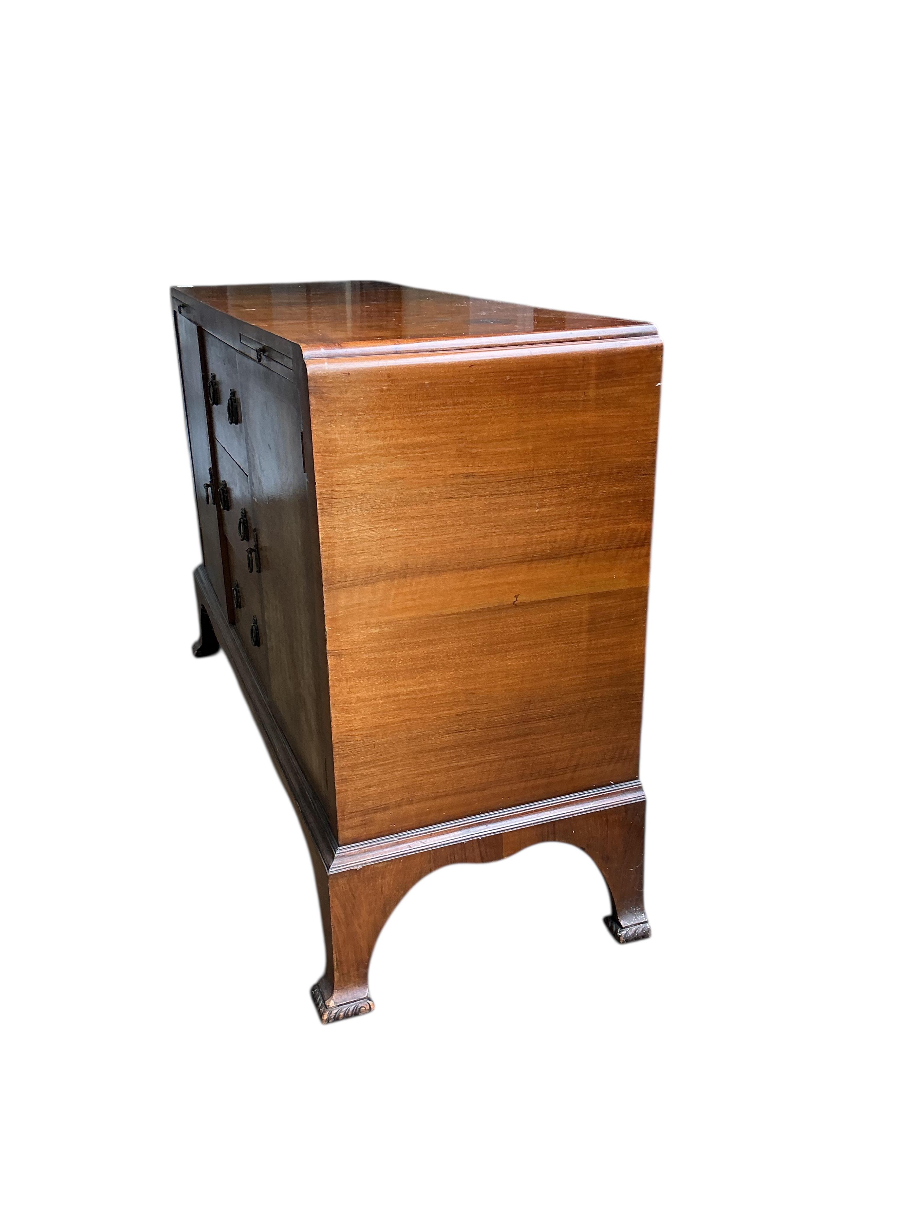 A 1930’s walnut sideboard, width 132cm, depth 46cm, height 90cm